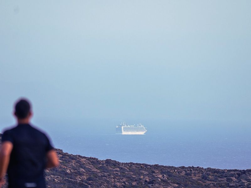 Tinos-run-half-marathon A man running the Tinos Running Experience half Marathon